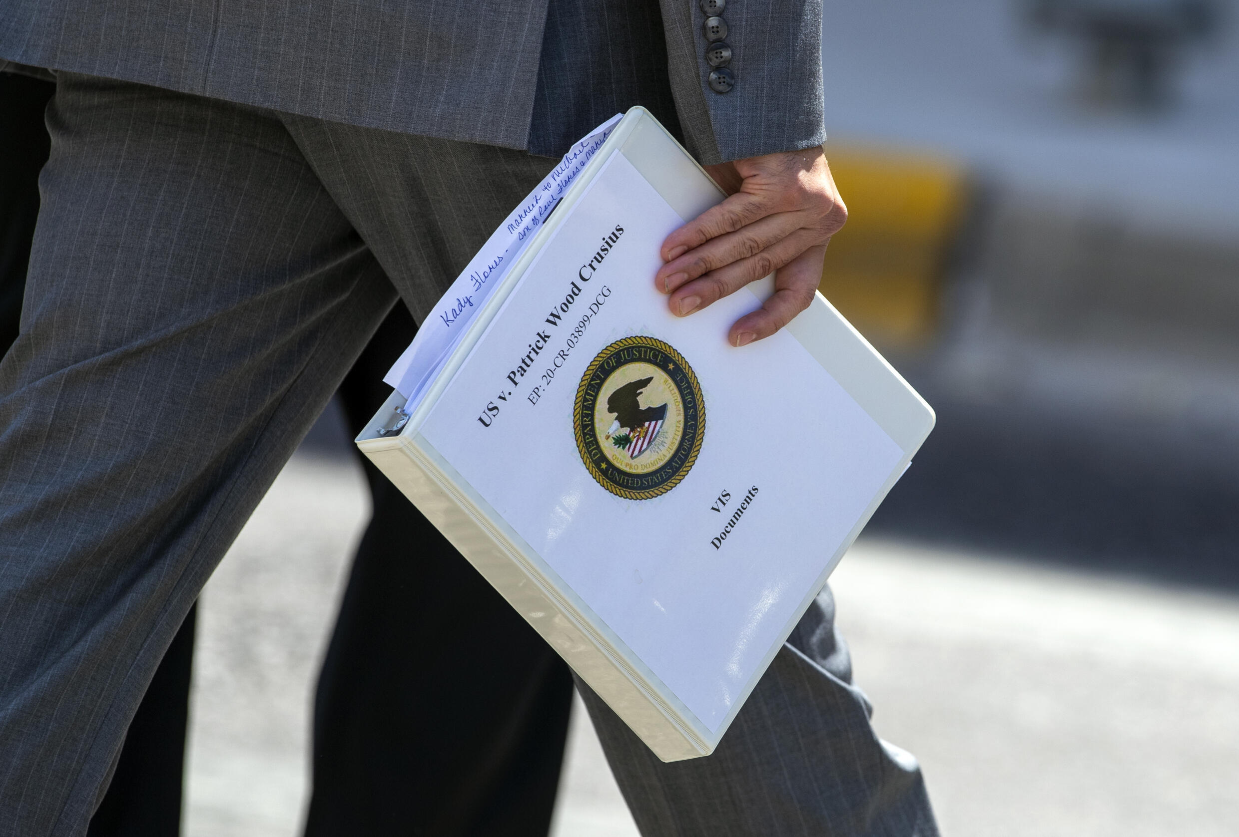 U.S. Attorney Ian Martinez Hanna holds a folder of Victim Impact Statement documents as he walks out of court for lunch on the second day of the sentencing hearing for mass shooter Patrick Crusius in El Paso, Texas, Thursday, May 6. July 2023.