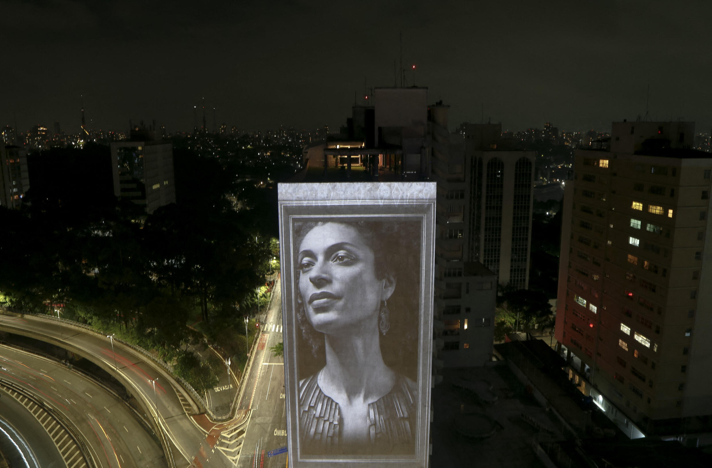 An image of slain Brazilian human rights activist and politician Marielle Franco is projected onto the side of the Anchieta Building on the fifth anniversary of her assassination, as part of a tribute by visual artist Alexis Anastasiou to slain human rights activists, in Sao Paulo, Brazil, on March 14, 2023.