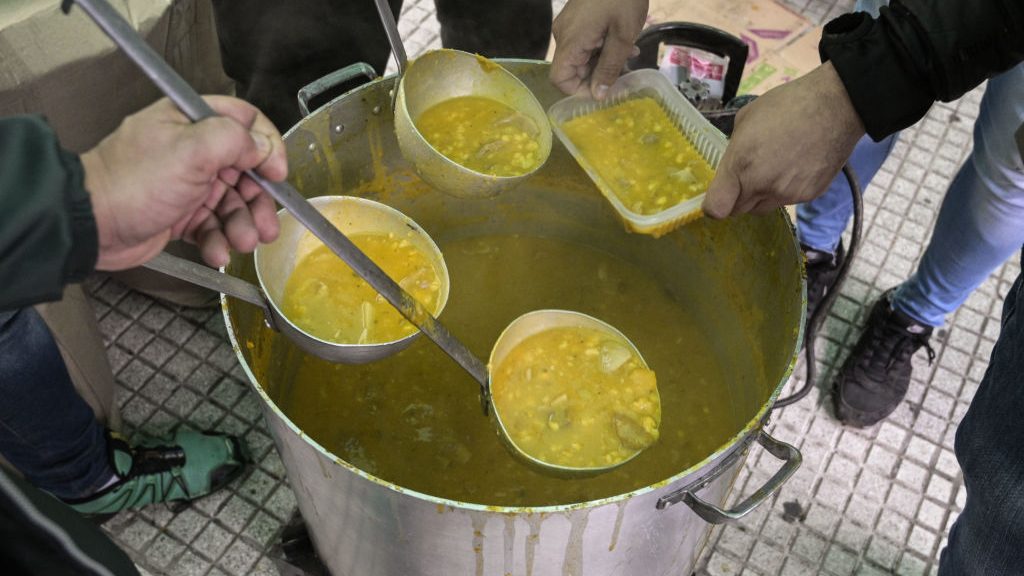 Members of a union in Argentina prepare a locro in Buenos Aires, on May 29, 2019. (Credit: JUAN MABROMATA/AFP via Getty Images)