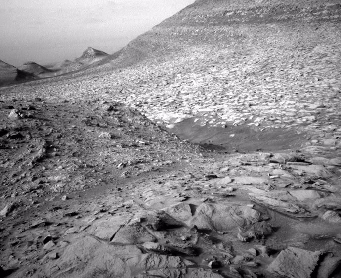 Image taken by NASA's Curiosity rover of rugged terrain on Mars.