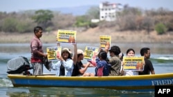 About ten boats with environmental defenders from El Salvador, Guatemala and Honduras demonstrated against the Cerro Blanco mining company on Lake Guija in Metapán, El Salvador, on April 19, 2024.