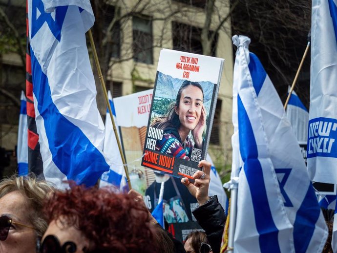 File - A demonstrator protests with a poster of hostage Noa Argamani, kidnapped during the October 7 attacks by Hamas