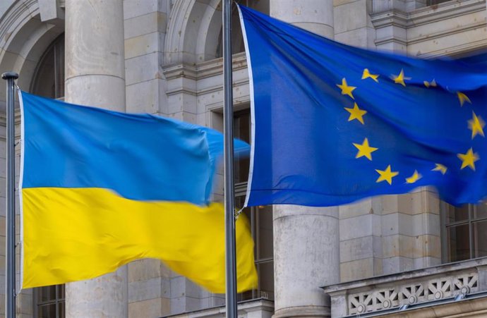 File - FILED - 24 April 2023, Berlin: The national flag of Ukraine and the flag of the EU are flying in the wind.  Photo: Monika Skolimowska/dpa