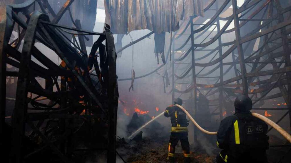 Firefighters put out the fire in the supermarket bombed by Russia in Kharkiv.