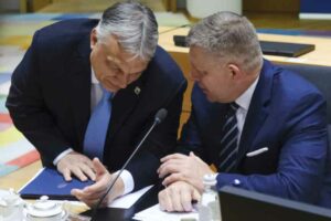 The Slovak Robert Fico talks with the Hungarian Viktor Orbán during the last European Council in March