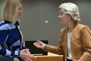 Estonian Prime Minister Kaja Kallas talks with President Ursula von der Leyen during a European Council