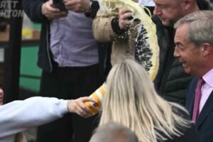 A milkshake is thrown in the face of populist Nigel Farage at his first campaign event in the United Kingdom