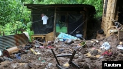 A view of the site where Luis Ernesto Godines Guzmán, Jennifer Yamileth Magaña Godines and Eduardo Vladimir Orantes Godines, died in a landslide due to heavy rains, in Tacuba, El Salvador, on June 18, 2024.