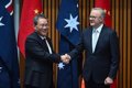 Australia's Prime Minister receives his Chinese counterpart on his first visit in seven years