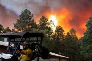 Falling temperatures and rain could help control fires in New Mexico