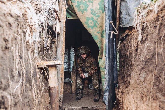 File - A Ukrainian army soldier takes a break inside a trench on the New York front (file).