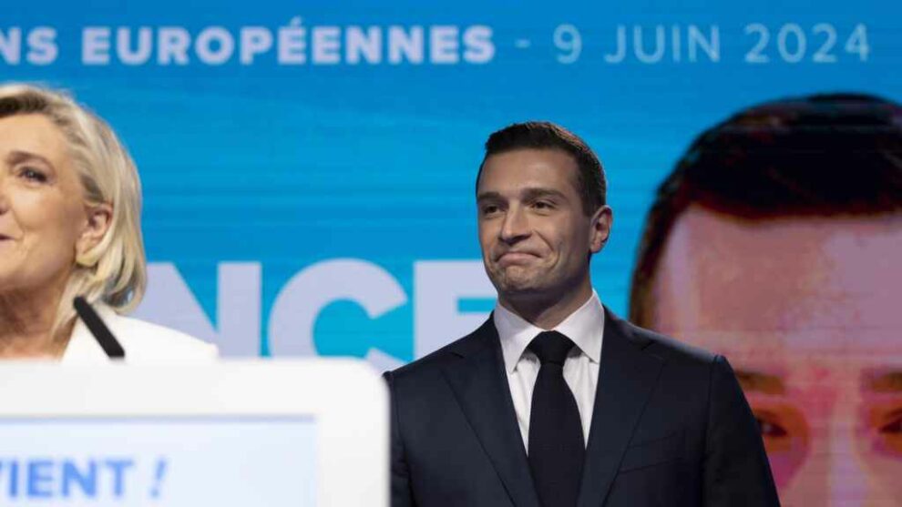 Marine Le Pen and Jordan Bardella give a speech at the National Rally party in Paris on Sunday.