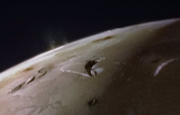 The JunoCam instrument, aboard NASA's Juno space probe, captured two volcanic plumes rising above the horizon of Jupiter's moon Io.  The image was taken on February 3 from a distance of approximately 3,800 kilometers.