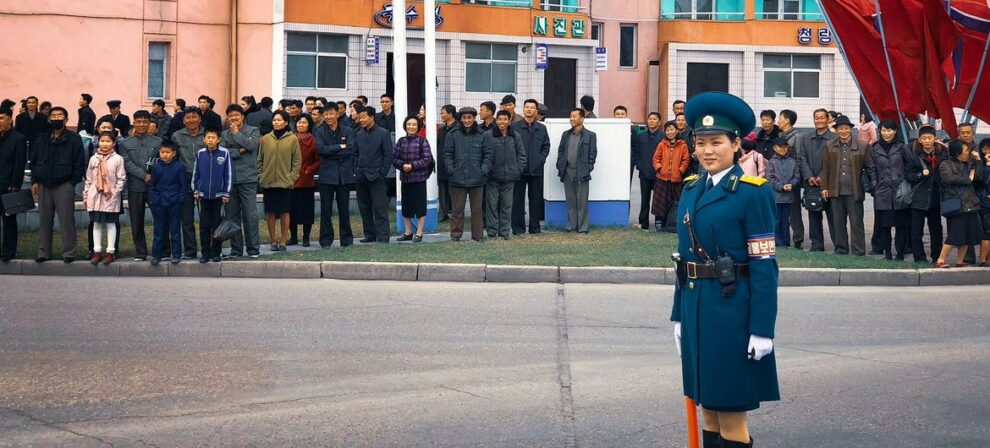 Residents of Pyongyang, Democratic People's Republic of Korea, waiting to cross the road.