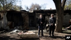 FILE - Argentina's President Javier Milei, right, and Israel's President Isaac Herzog make a joint statement on February 8, 2024 at Kibbutz Nir Oz, where a quarter of the community was killed or kidnapped in the October 7 attack.  (AP Photo/Maya Alleruzzo, File)