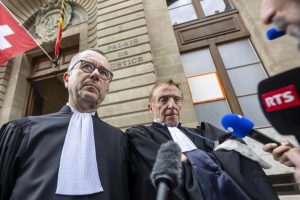 Lawyers for the accused, Nicolas Jeandin (left) and Robert Assael (right), leave the court after a break in the reading of the verdict, during the trial against members of the Hindu billionaire Hinduja family.