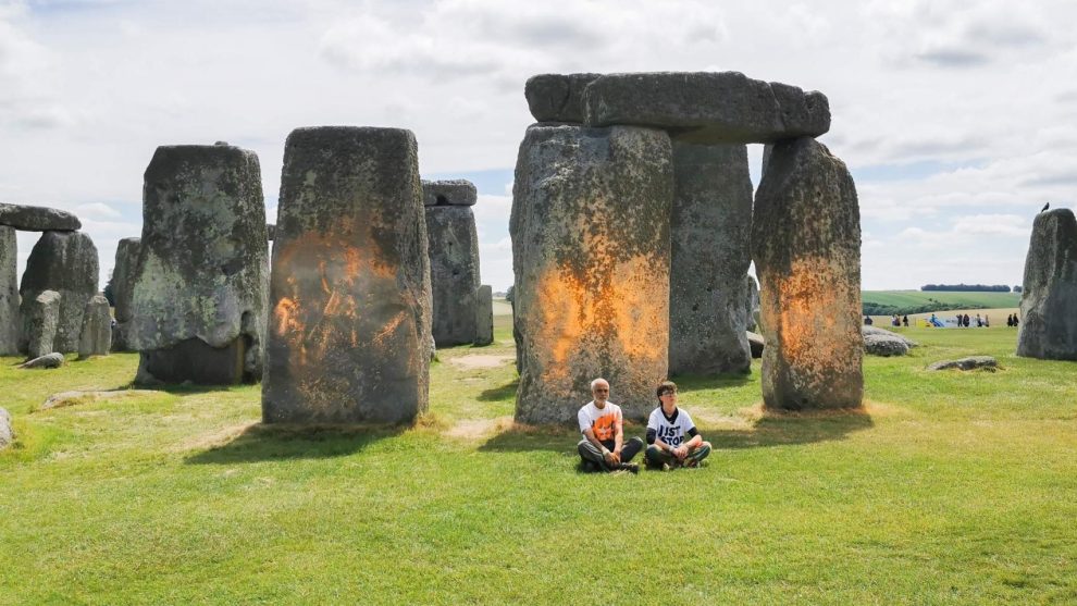 Two activists spray paint on Stonehenge to demand end to fossil fuels