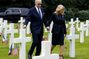 US President Joe Biden and first lady Jill Biden walk at the Normandy American Cemetery and Memorial in Colleville-sur-Mer, France, on June 6, 2024