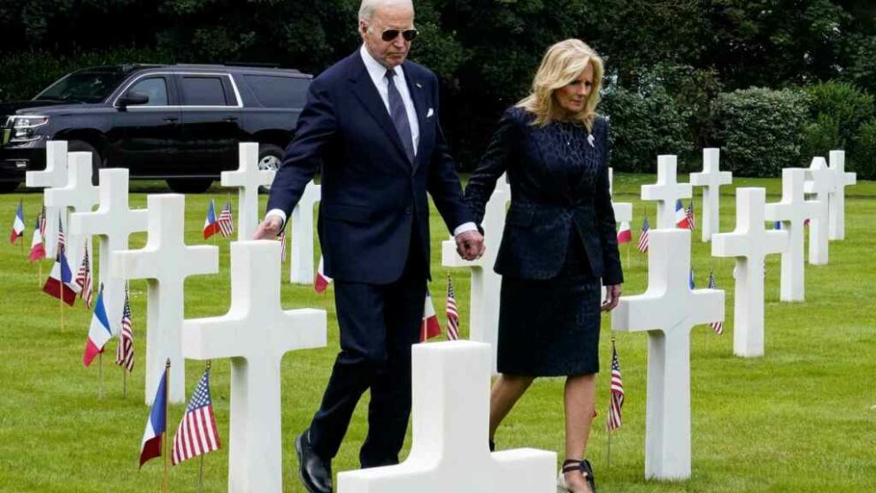 US President Joe Biden and first lady Jill Biden walk at the Normandy American Cemetery and Memorial in Colleville-sur-Mer, France, on June 6, 2024