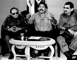 Nicaraguan Defense Minister Humberto Ortega (right), his brother, President Daniel Ortega (center) and Interior Minister Tomás Borges, on December 30, 1989. (AP Photo/Ernest Mejia, File)