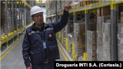 A worker from Droguería INTI SA tours the pharmaceutical distribution facility.