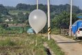 A balloon with garbage sent by North Korea falls into the compound of the South Korean Presidential Office