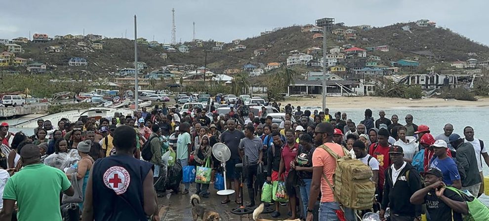 Residents of Union Island in St. Vincent and the Grenadines board a ferry to reach a shelter from Hurricane Beryl.