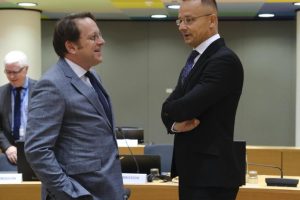 Hungarian Foreign Minister Péter Szijjártó talks with Hungarian Enlargement Commissioner Olivér Várhelyi during their meeting in Brussels on Monday