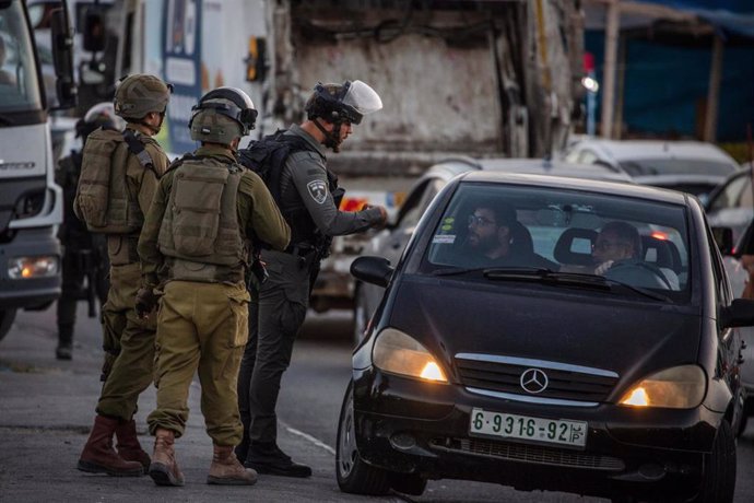 File - 09 October 2022, Israel, Jerusalem: Israeli soldiers blocking the entrance to Shuafat refugee camp as Israeli Police and Security services are searching for a shooter after an Israeli soldier was killed in an attack on a checkpoint in East Jerus