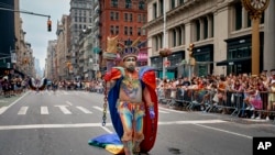 A participant performs during the NYC Pride Parade on June 30, 2024 in New York.