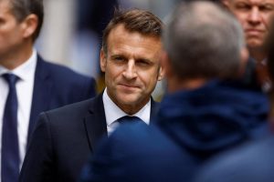 Macron will not name a prime minister until the parties agree on a "solid majority"