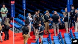 Security officers prepare ahead of the 2024 Republican National Convention, July 13, 2024, in Milwaukee.