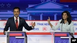 FILE - Businessman Vivek Ramaswamy and former U.N. Ambassador Nikki Haley speak during a Republican primary debate hosted by FOX News, in Milwaukee, Wisconsin, Aug. 23, 2023. The two were competing for the 2024 Republican presidential nomination.