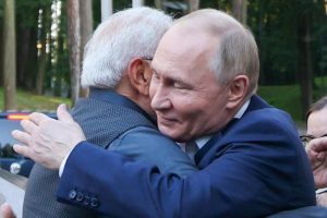 Russian President Vladimir Putin hugs Indian Prime Minister Narendra Modi on Monday at the start of his two-day visit to Russia.