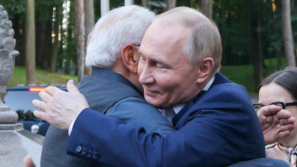 Russian President Vladimir Putin hugs Indian Prime Minister Narendra Modi on Monday at the start of his two-day visit to Russia.