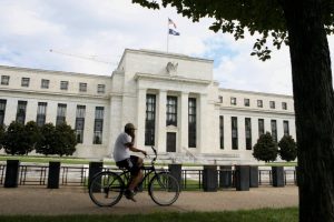 Fed holds rates, points to possible cut in September