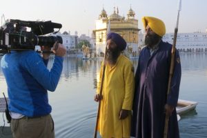 Two men outside the Golden Temple, a central place of prayer for Sikhs in Amritsar, India.