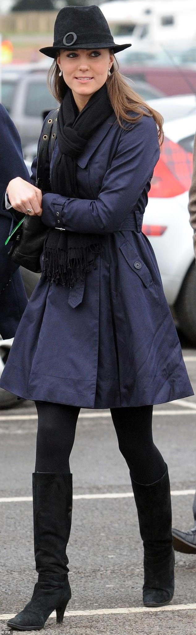 The then-Kate Middleton was snapped wearing a navy Ted Baker trench on several occasions (pictured attending the last day of the Cheltenham National Hunt Festival meeting in 2008)