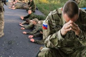 Screenshot from a video released by Ukrainian forces showing several Russian soldiers surrendering in the Kursk region.