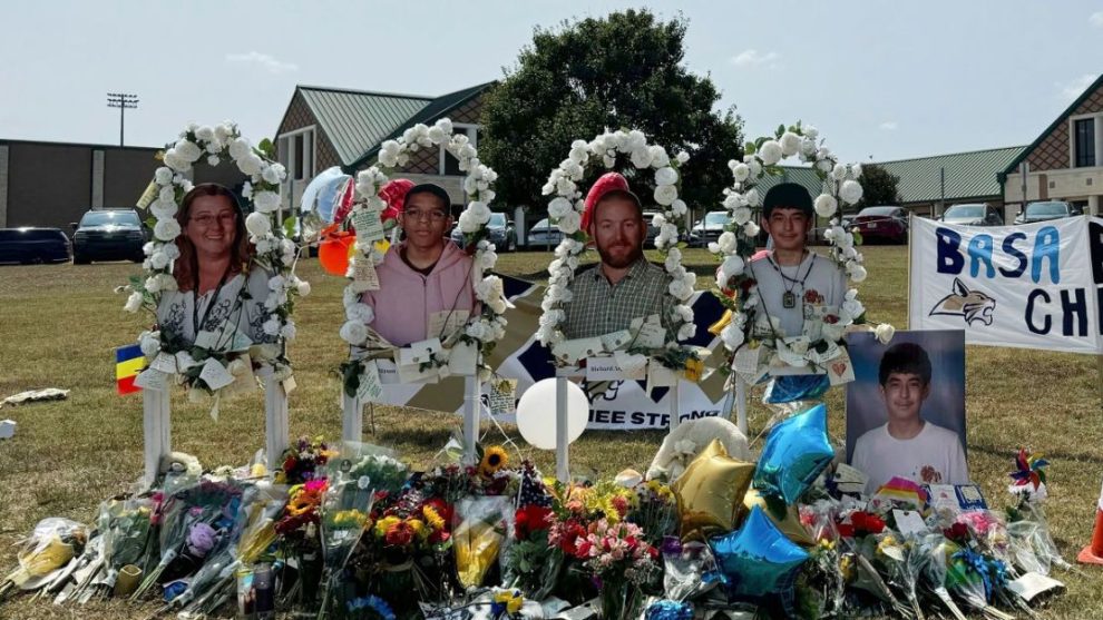 Posters with images of the victims of the attack, from left, Cristina Irimie, Mason Schermerhorn, Richard Aspinwall and Christian Angulo, are displayed at a memorial outside Apalachee High School in Winder, Georgia, on Sept. 10, 2024.