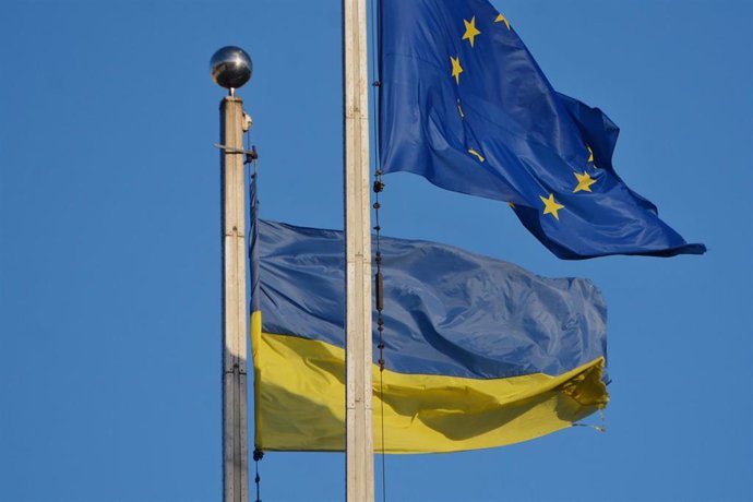 File - Image of the flags of Ukraine and the European Union