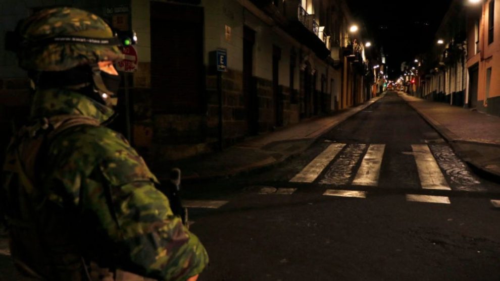 Ecuadorian policemen check the documents of a couple of motorcyclists on a street during a scheduled national rationing of electricity due to maintenance of the transmission system and distribution networks, in Quito on September 18, 2024.