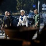 European Commission President Ursula von der Leyen, center, on her way to visit a memorial wall commemorating fallen Ukrainian soldiers in the war with Russia, in kyiv, Sept. 20. Christoph Soeder/AP