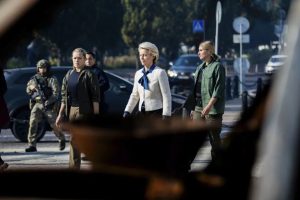 European Commission President Ursula von der Leyen, center, on her way to visit a memorial wall commemorating fallen Ukrainian soldiers in the war with Russia, in kyiv, Sept. 20. Christoph Soeder/AP