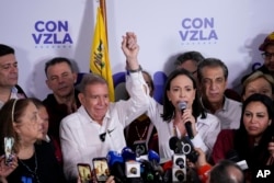 Opposition leader Maria Corina Machado and presidential candidate Edmundo Gonzalez hold a press conference after electoral authorities declared Nicolas Maduro the winner of the presidential election in Caracas, Venezuela, Monday, July 29, 2024.