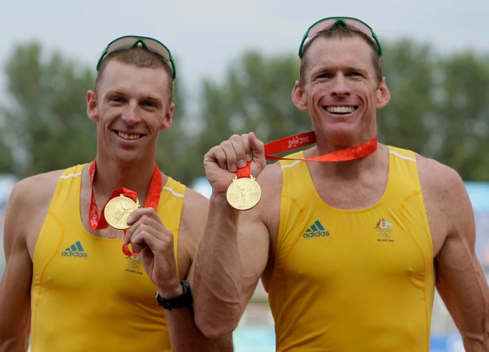 Australians Drew Ginn (left) and Duncan Free display their gold medals in the men's pair rowing at the Beijing 2008 Olympic Games on August 16, 2008.