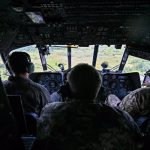 File - Ukrainian soldiers on board a plane