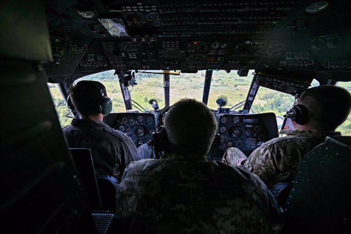 File - Ukrainian soldiers on board a plane