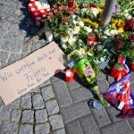 Flowers, candles and tributes near the site of the stabbings that left three dead and eight injured on August 24, 2024 in Solingen, Germany. Courtesy: Sascha Schuermann/Getty Images