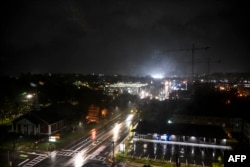 A deserted street is seen as heavy rain falls before Hurricane Helene makes landfall in Tallahassee, Florida, on September 26, 2024.